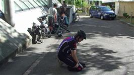 Ash folds his bike bag as we prepare to leave Basel Youth Hostel
